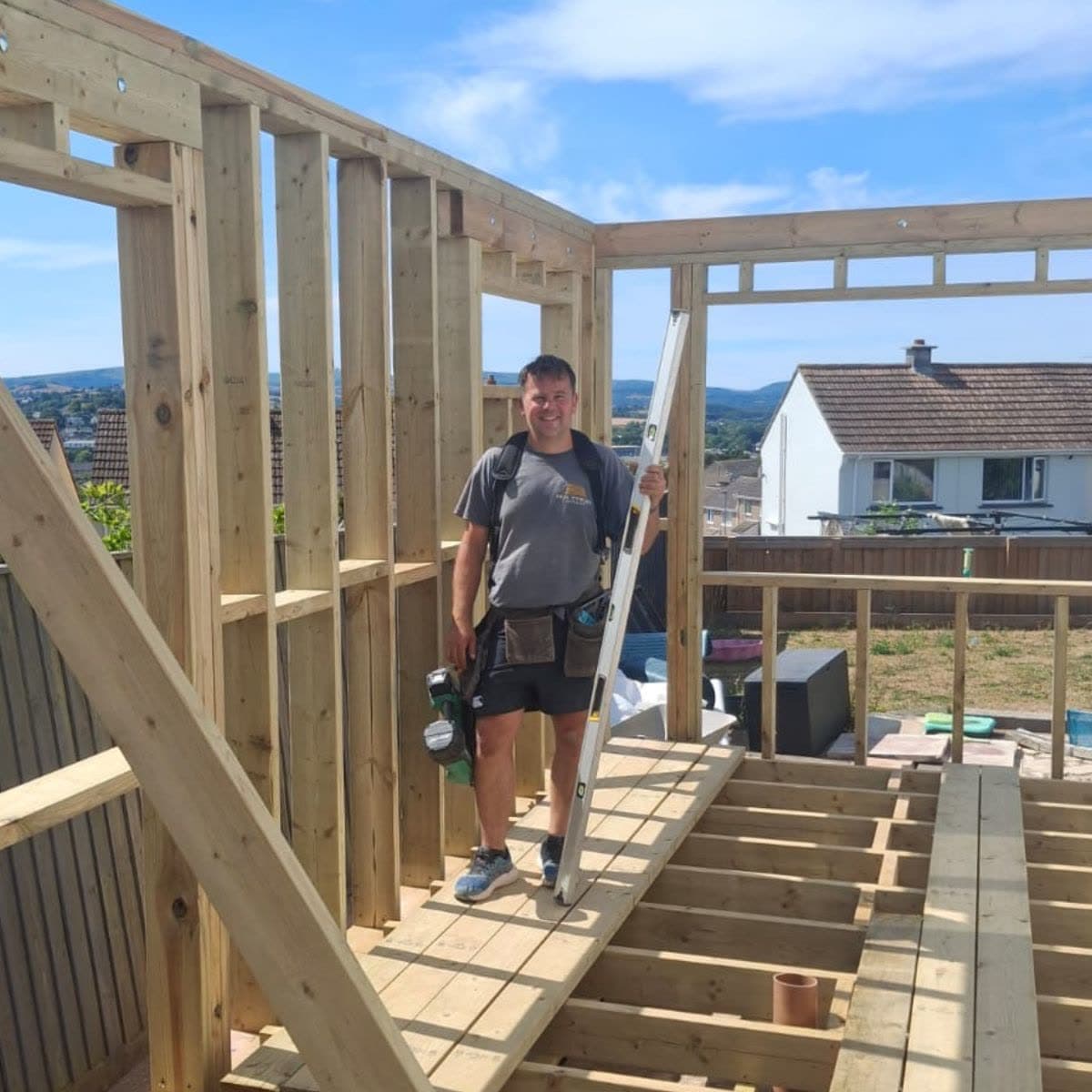Paul Vowles on site in Torbay, spirit level in hand